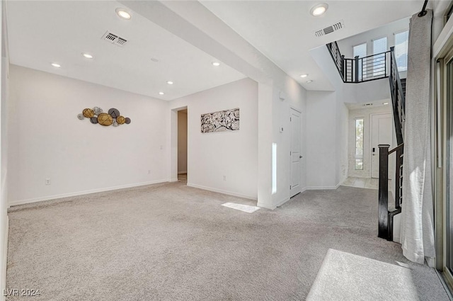 interior space featuring light colored carpet