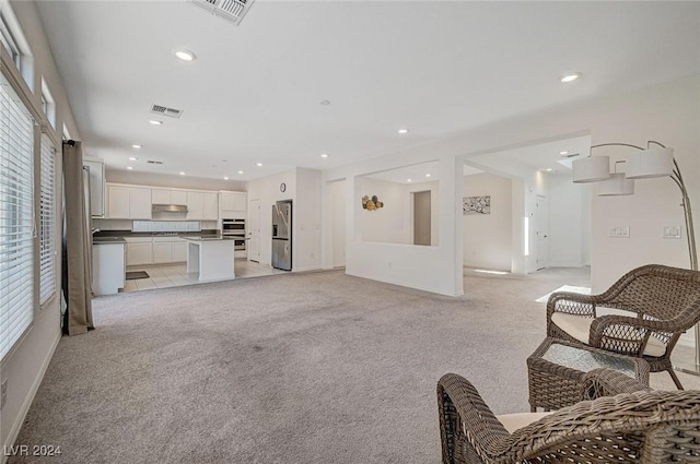 living room featuring light colored carpet