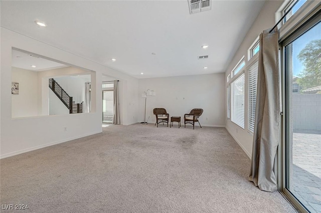 sitting room with light colored carpet