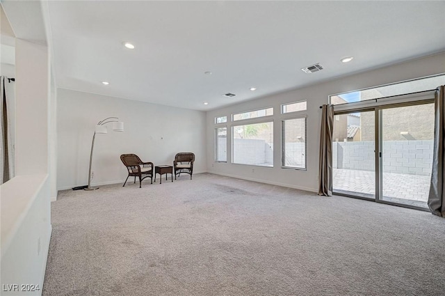 unfurnished room with light colored carpet