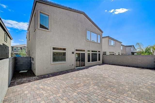 back of house featuring a patio