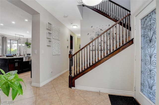 stairs featuring tile patterned flooring