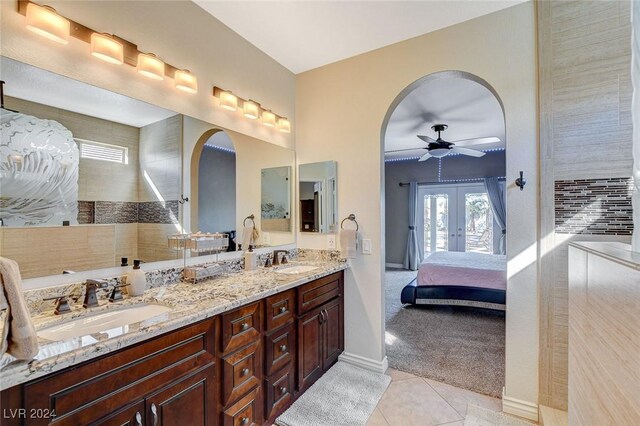 bathroom featuring french doors, vanity, tile patterned floors, and ceiling fan