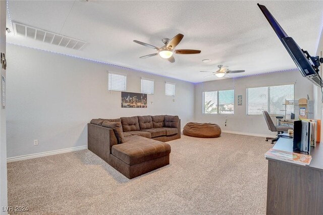 living room with carpet flooring and ceiling fan