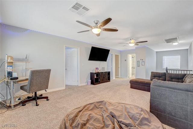 living room featuring ceiling fan and carpet