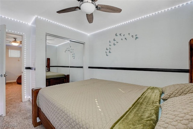 bedroom with carpet flooring, ceiling fan, and a closet