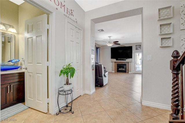 hallway featuring light tile patterned flooring