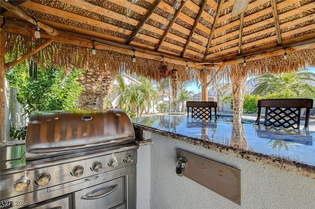 view of patio / terrace with a gazebo and a grill