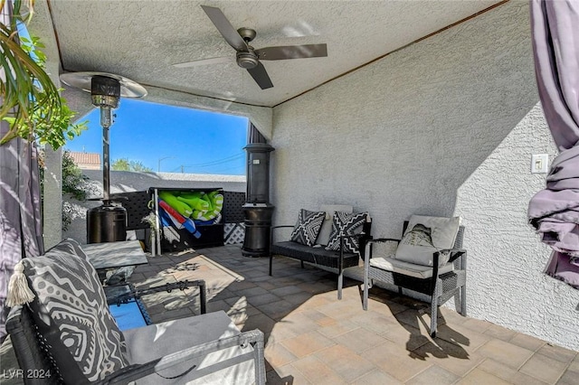 view of patio / terrace featuring an outdoor living space and ceiling fan