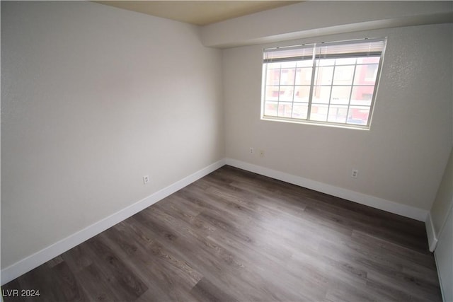 empty room featuring dark hardwood / wood-style floors