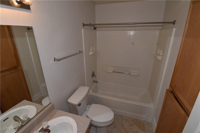 full bathroom with washtub / shower combination, tile patterned floors, vanity, and toilet