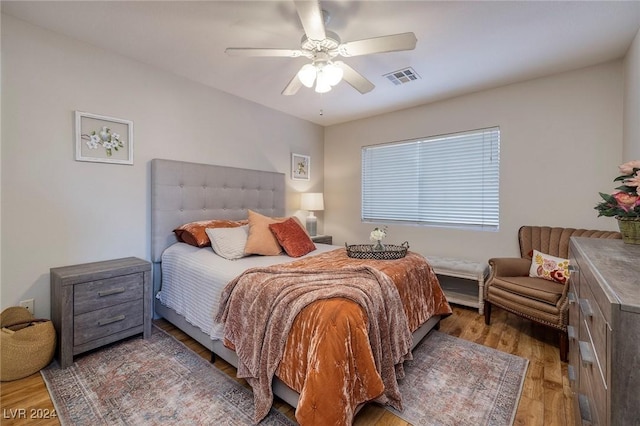 bedroom with hardwood / wood-style floors and ceiling fan