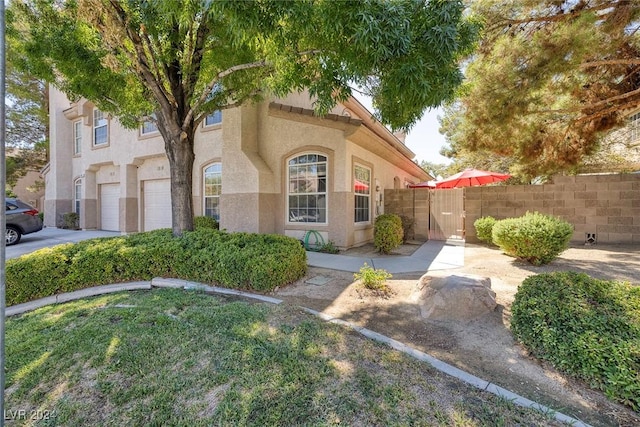 mediterranean / spanish-style home featuring a garage