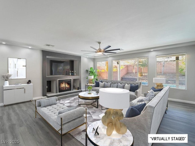 living room with hardwood / wood-style floors and ceiling fan