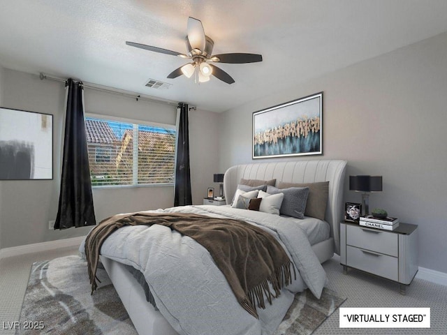 bedroom featuring ceiling fan and light carpet