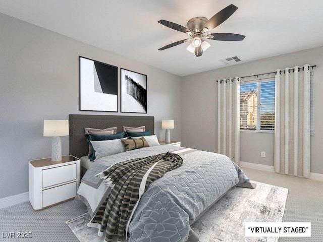 bedroom featuring light carpet and ceiling fan