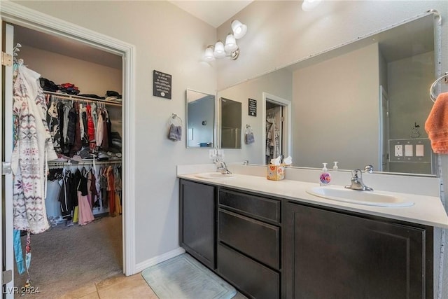 bathroom featuring tile patterned flooring and vanity