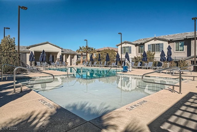 view of swimming pool with a patio