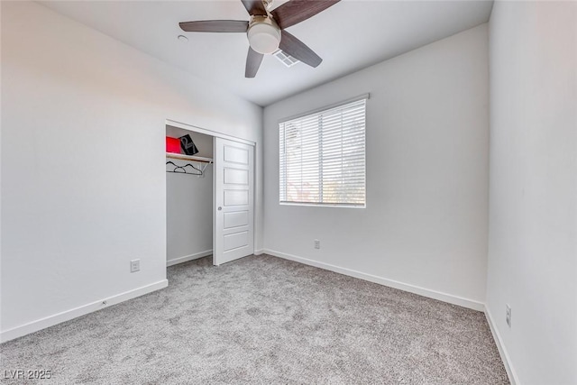 unfurnished bedroom featuring carpet floors, visible vents, and baseboards