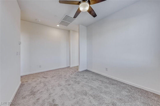 carpeted spare room with a ceiling fan, recessed lighting, visible vents, and baseboards