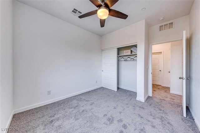 unfurnished bedroom featuring carpet, visible vents, and baseboards