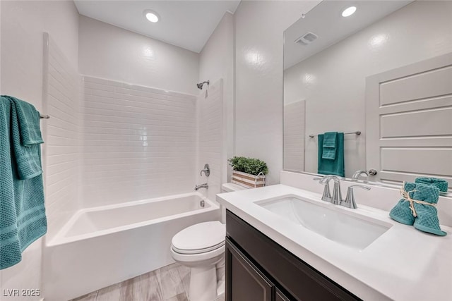 full bath featuring visible vents, toilet, shower / tub combination, vanity, and recessed lighting