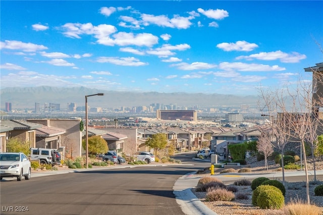 property's view of city with a mountain view