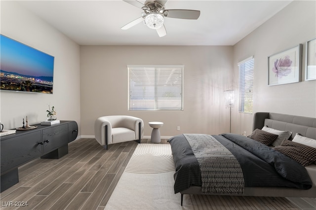 bedroom with ceiling fan and dark wood-type flooring