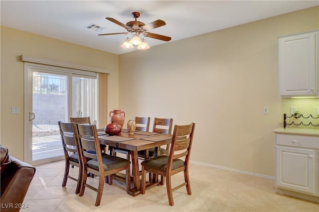 dining area featuring ceiling fan and light tile patterned floors