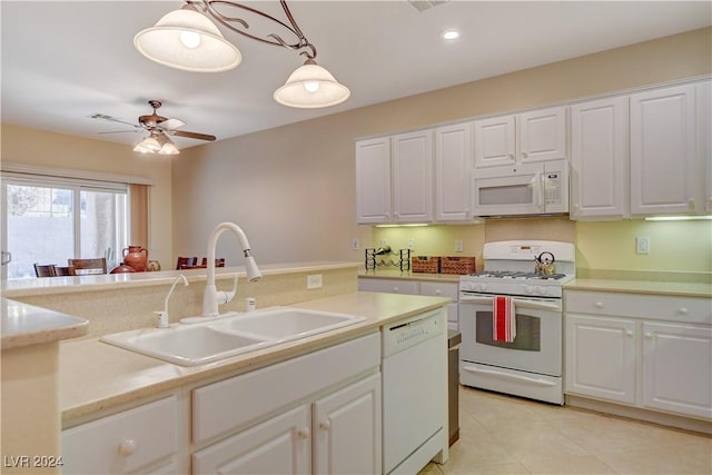 kitchen featuring white appliances, sink, ceiling fan, decorative light fixtures, and white cabinetry