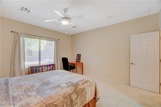 bedroom with ceiling fan and light colored carpet