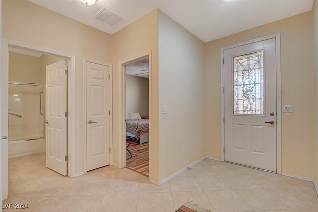 entryway featuring light tile patterned flooring