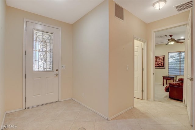 tiled foyer entrance featuring ceiling fan