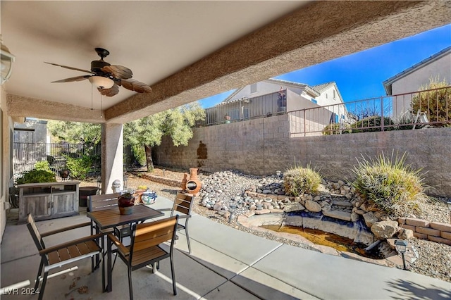 view of patio featuring area for grilling and ceiling fan