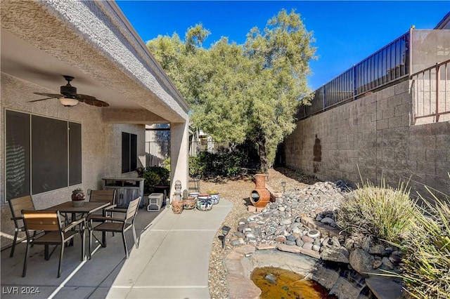 view of patio / terrace featuring ceiling fan