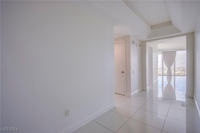 hallway featuring light tile patterned floors