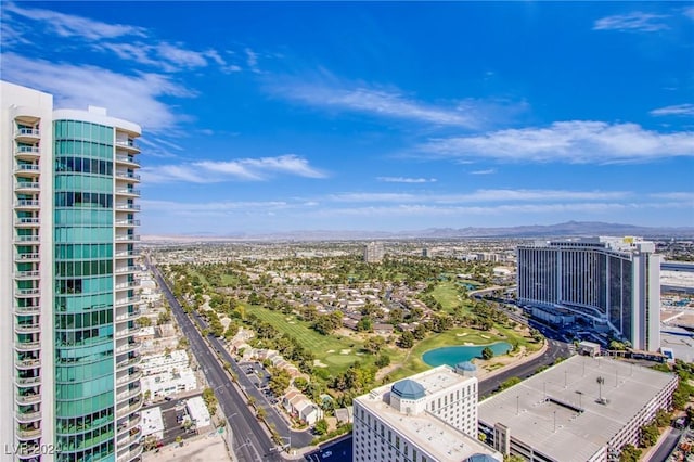 birds eye view of property with a mountain view