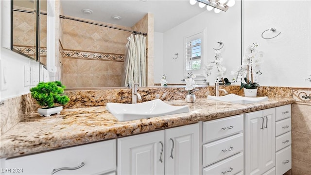 bathroom featuring a shower with curtain and vanity