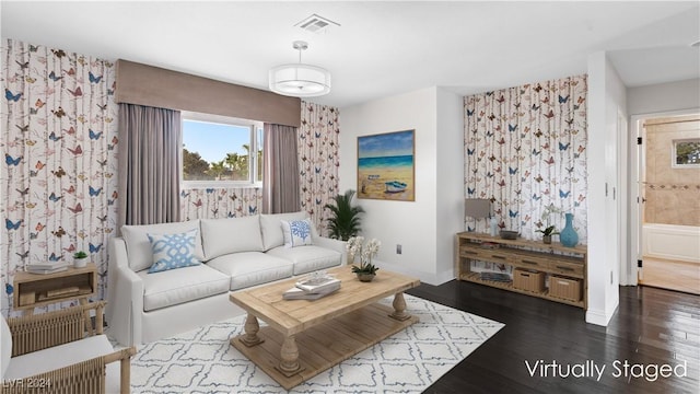 living room with dark hardwood / wood-style floors