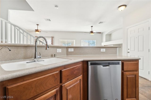 kitchen with dishwasher, ceiling fan, light tile patterned floors, and sink