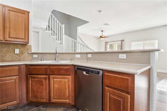 kitchen featuring dishwasher, sink, ceiling fan, decorative backsplash, and kitchen peninsula