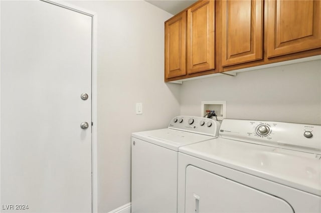 laundry area featuring cabinets and independent washer and dryer