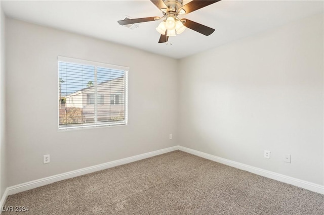 carpeted empty room featuring ceiling fan