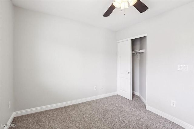 unfurnished bedroom featuring carpet flooring, a closet, and ceiling fan