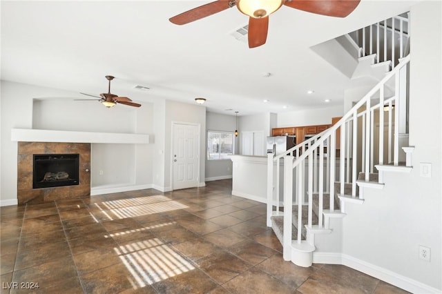 interior space with a tile fireplace