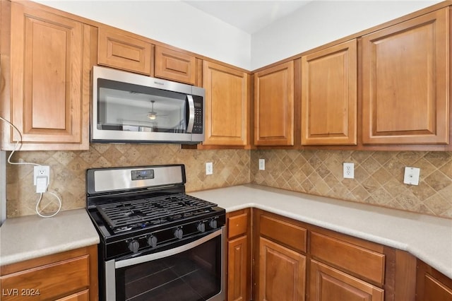 kitchen featuring backsplash and appliances with stainless steel finishes