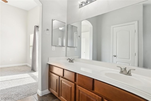 bathroom with tile patterned flooring and vanity