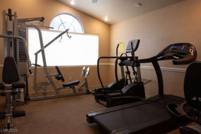 workout area with vaulted ceiling