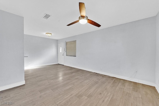 empty room featuring light wood-type flooring and ceiling fan