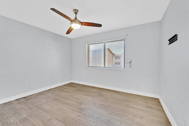 spare room with ceiling fan and light hardwood / wood-style floors